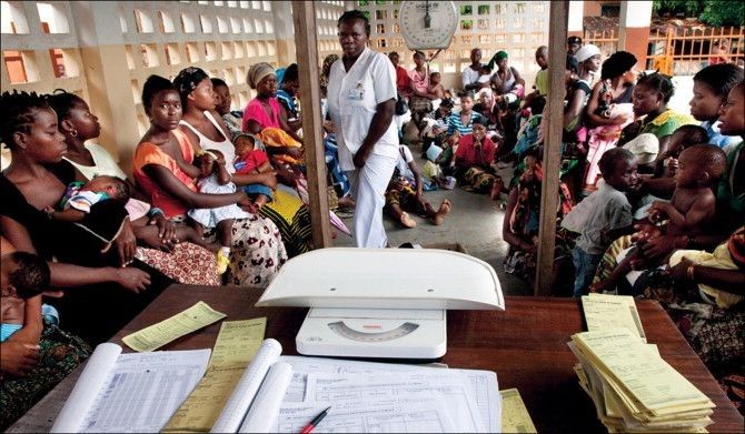  A community health worker or registration officer processing a birth registration on a 
mobile device in a Nigerian village setting

